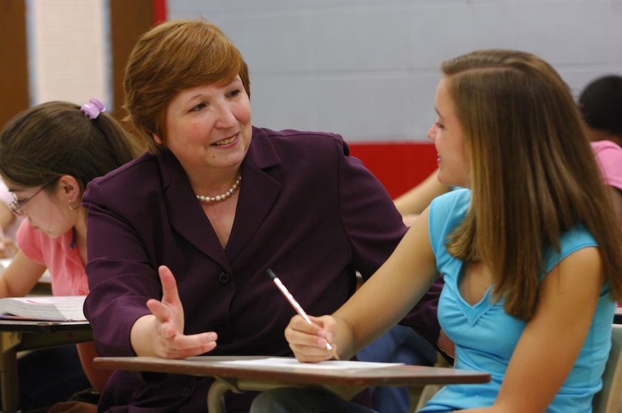 teacher talking to student