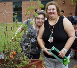 Nancy Burke (right) and student Taylor Warren (left) in the Haverhill High School garden.