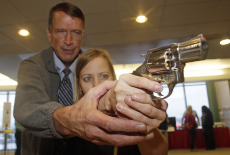 A fourth grade teacher in Utah receives firearms training with a .357 magnum from a personal defense instructor.