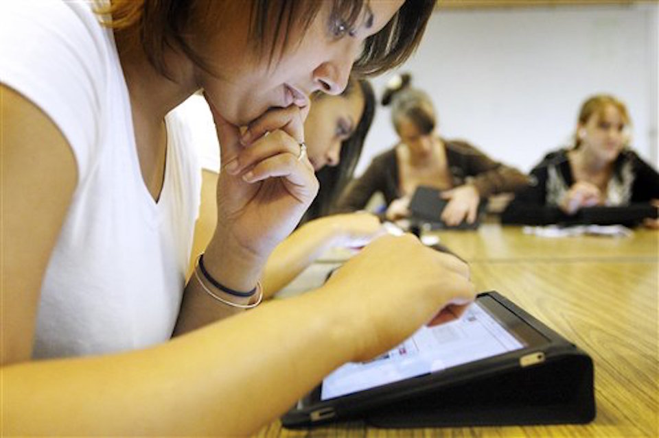 According to some estimates, more than $10 billion is spent on classroom technology every year. (AP Photo/The Casper Star-Tribune, Tim Kupsick)