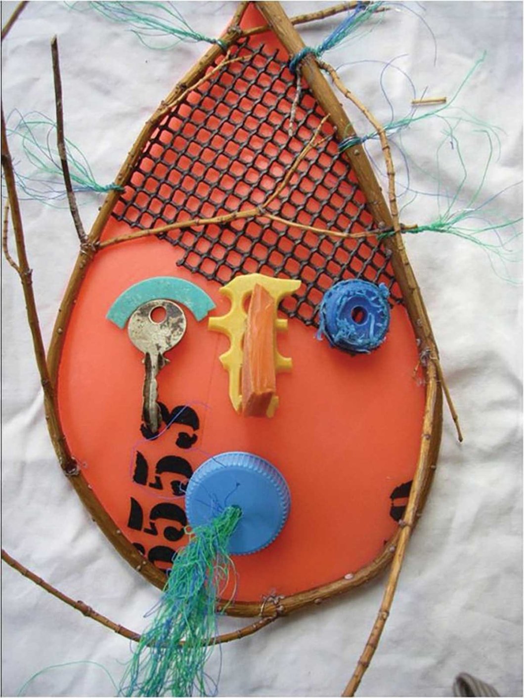 Art made from marine debris such as nets, buoys, plastic caps, and keys.