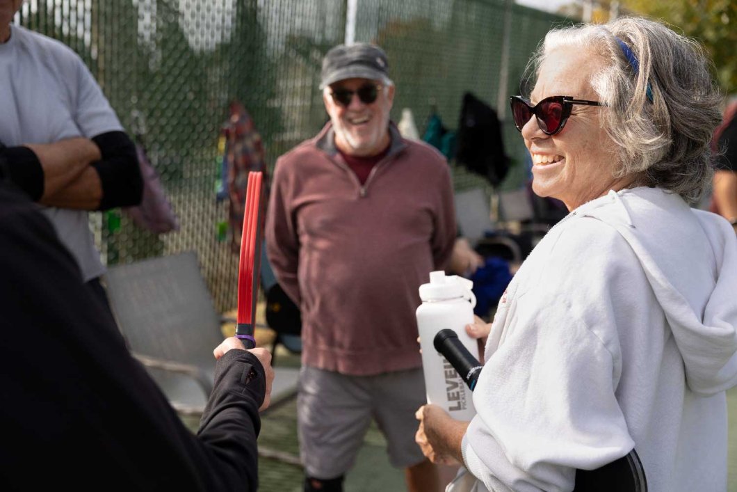 NEA-Retired member Susan Feiner socializing with her pickleball friends.
