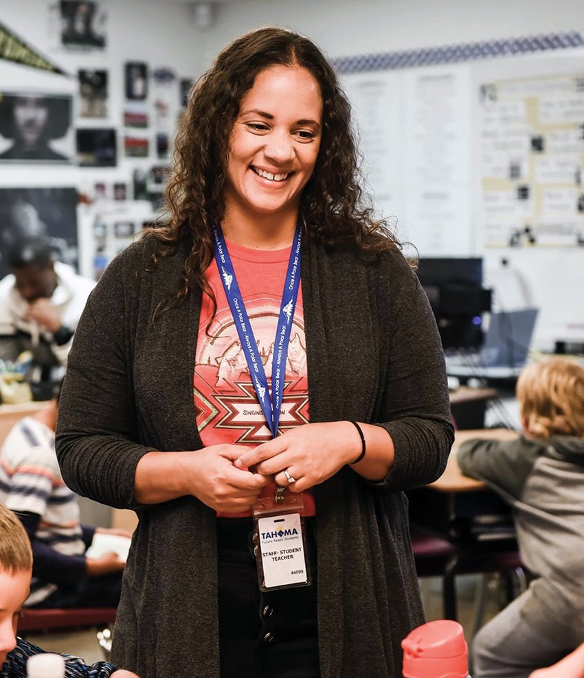 Angela Coran standing in her classroom