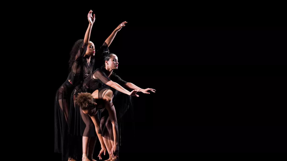three dancers at night