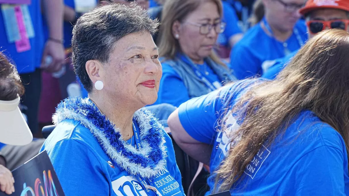 An NEA member attends a rally