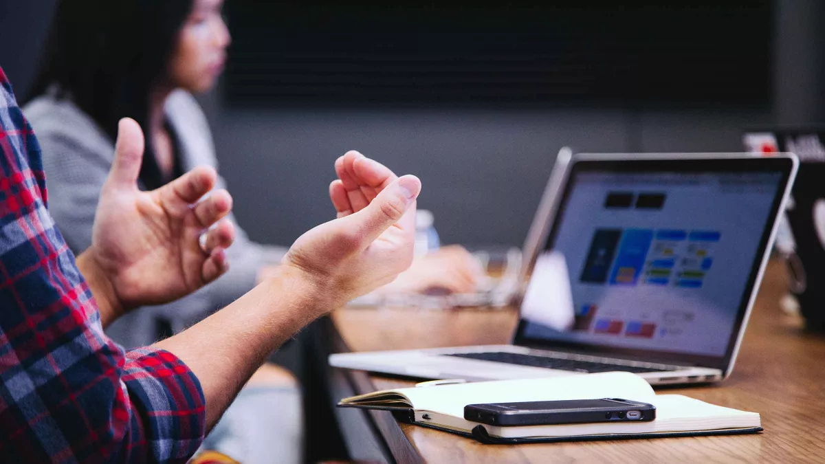 A man speaks in a meeting