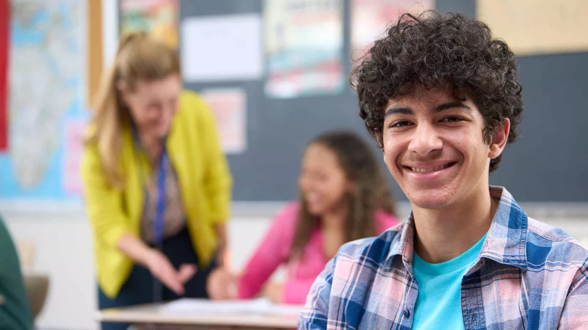 A smiling male high school student