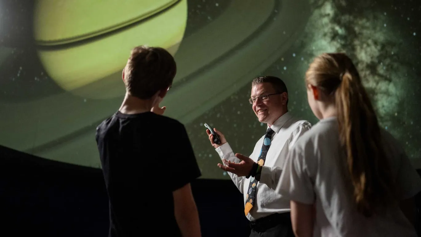 Science teacher Ryan Tucek takes his students to the school planetarium at least once a week