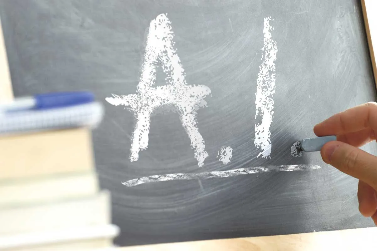 Black chalk tablet with A.I. written on it.