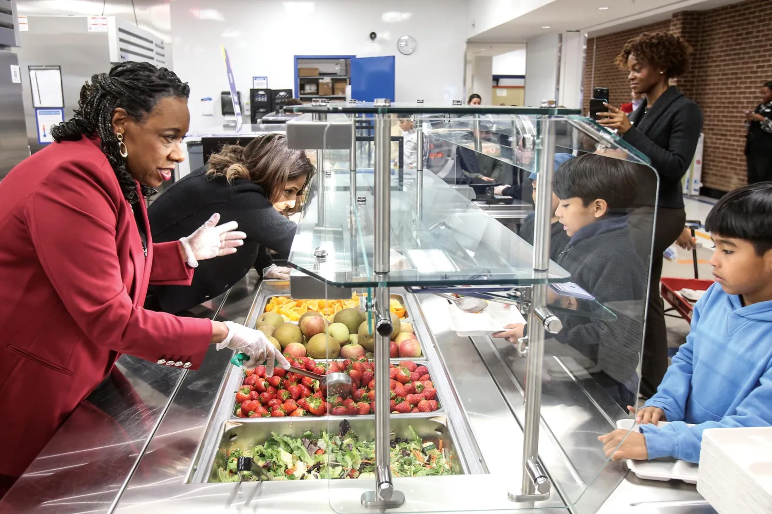 Becky Pringle serving up meals at a school cafeteria.