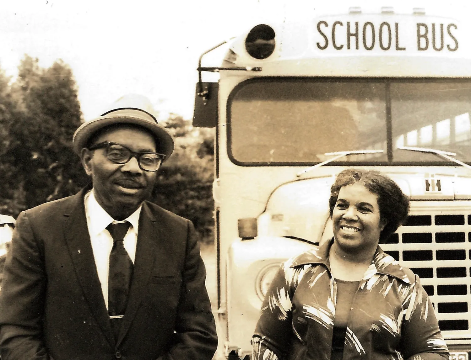 Historic photo of Princess Moss' parents in front of school bus