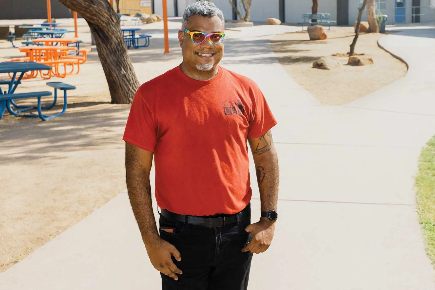 Estaban Flemons standing in an empty school yard.