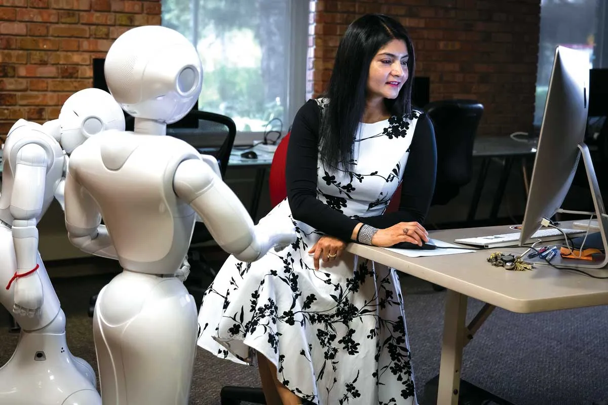 Arshia Khan working with her robots