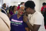 Attendees at the Conference on Racial and Social Justice greet each other in Orlando, Florida