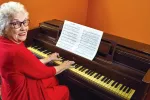 NEA-Retired Member Ruby Strickland playing piano.