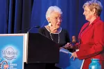 Former NEA-Retired President Sarah Borgman hands the ceremonial gavel to incoming NEA-Retired President Anita Gibson