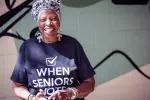 retired Atlanta teacher Lynda Wolfe Smith with a t-shirt that says When Seniors Vote