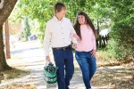Former educator Susan Jaysnovitch and her husband, Andy, stroll home from the farmer’s market, where they stocked up on fresh fruits and vegetables.