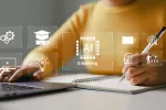 A person working on a laptop surrounded by icons representing AI learning concepts, while holding a pen about to write on a notepad on the other hand..