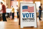 Sign with a wavy American flag and Vote Matters, Every Voice Counts, Make a Difference with voters in the background.