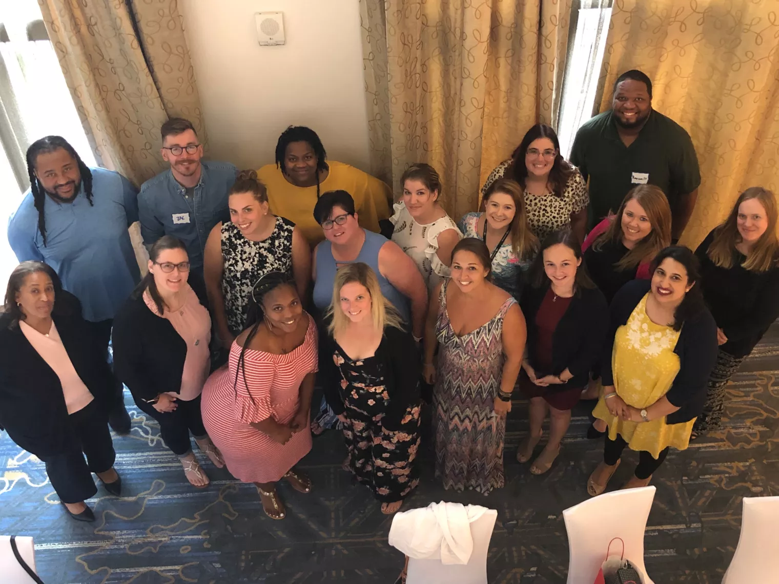 A group of early career educators participating in  a conference to learn strategies and network.