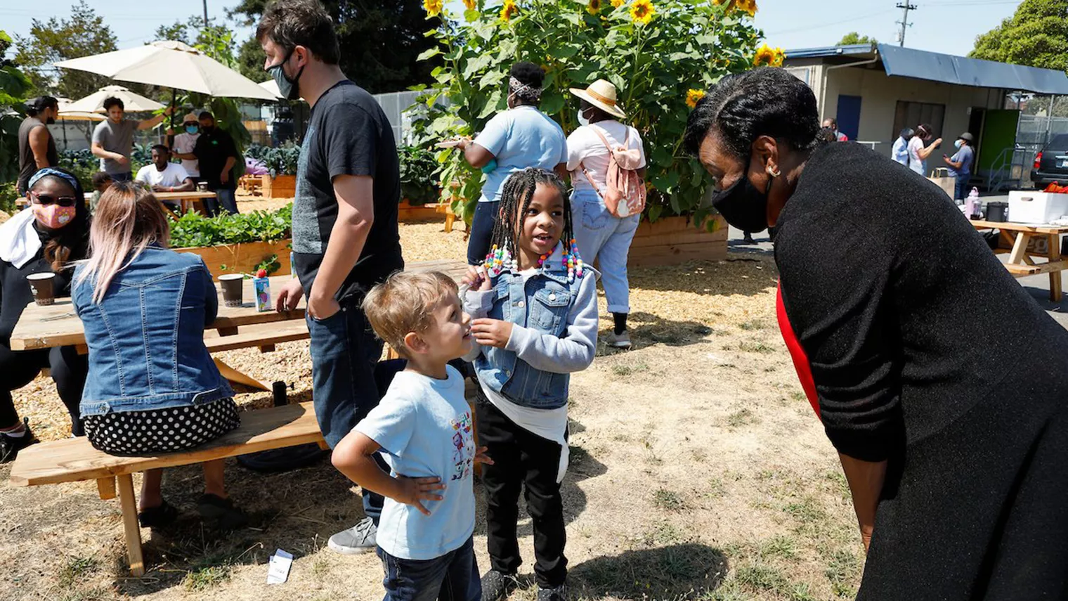 Becky Pringle talks to young children at school barbecue in California