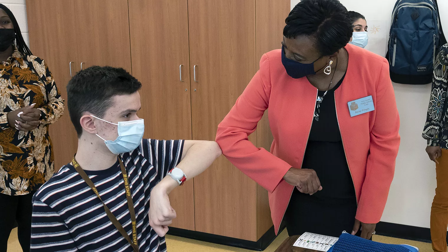 NEA President Becky Pringle greets a male student at Delran High School