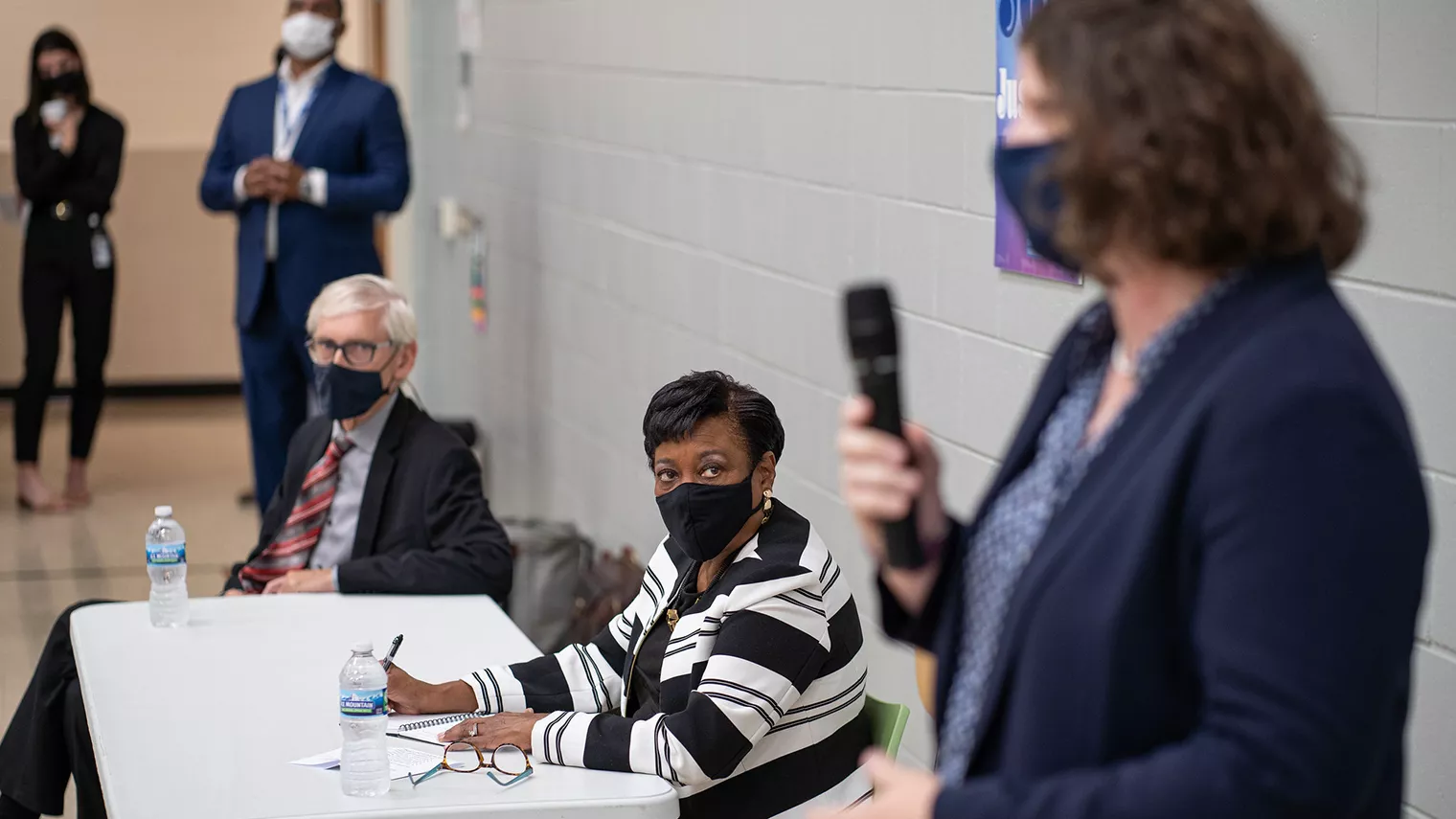 NEA President Becky Pringle takes notes at a school event at Hawthorne Elementary in Wisconsin