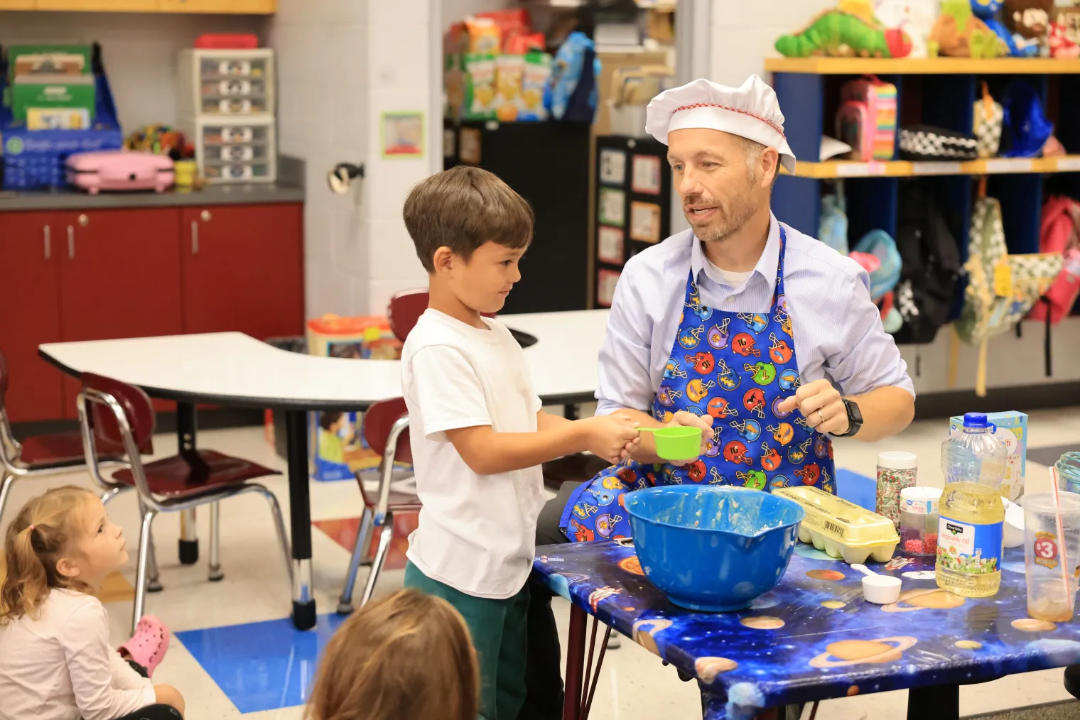 Dwayne Taylor and student cooking