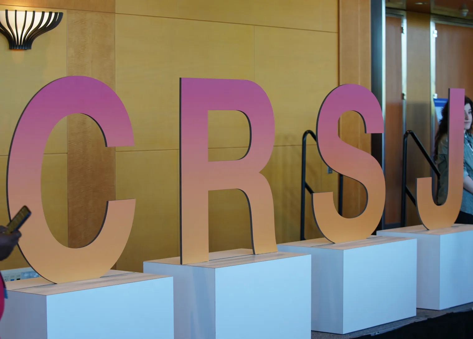 Large sculptural letters reading CRSJ