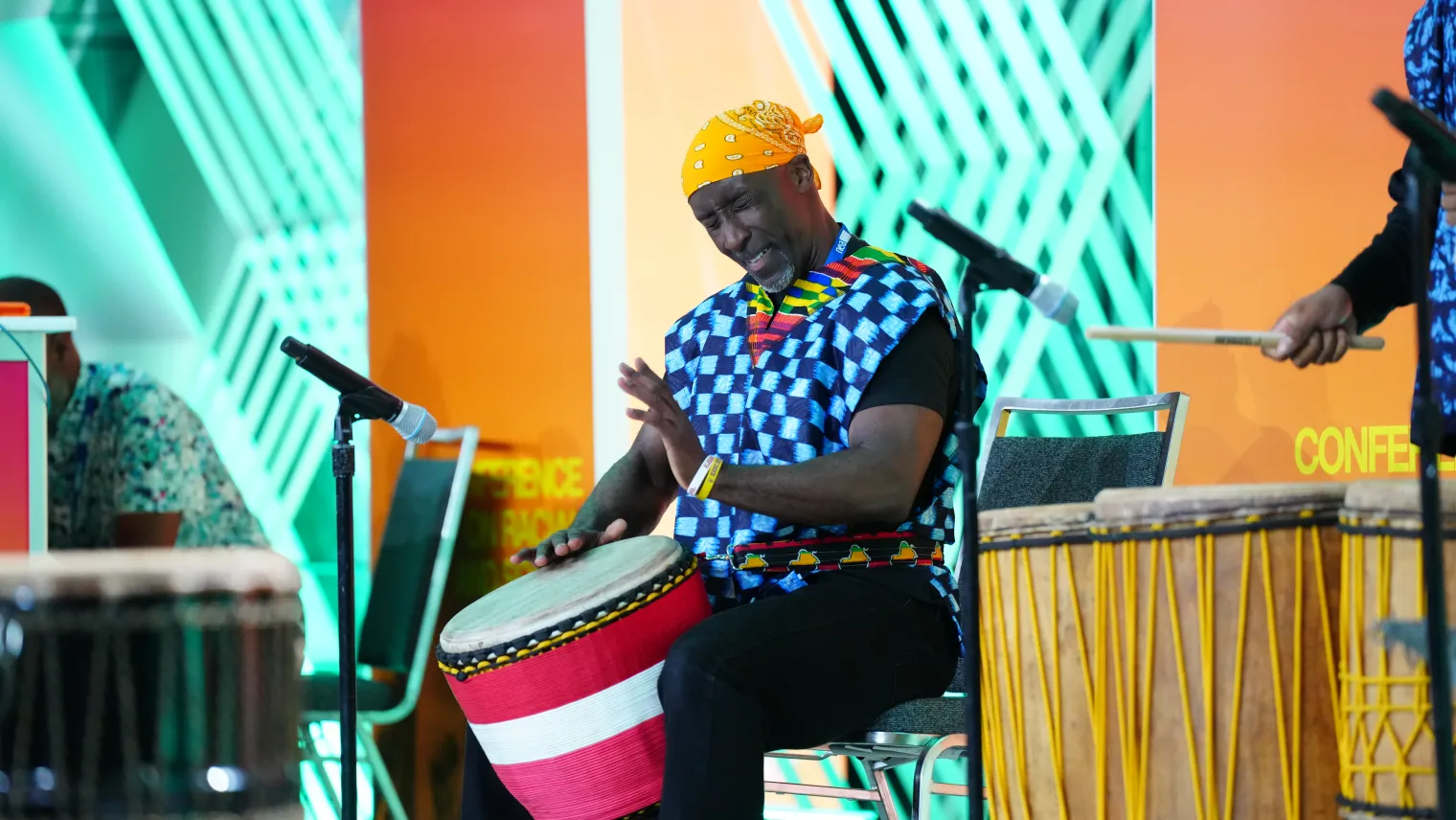 Man playing traditional African drum