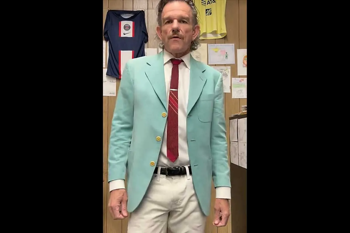 Mr. Ward in a aqua marine jacket.