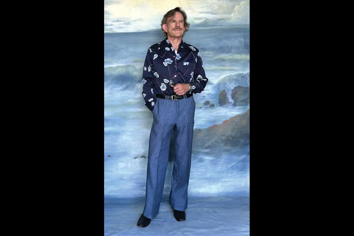 Mr. Ward in a blue outfit.