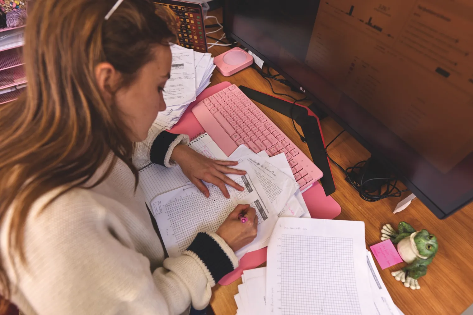 Ellie Bollich grading papers at a desk