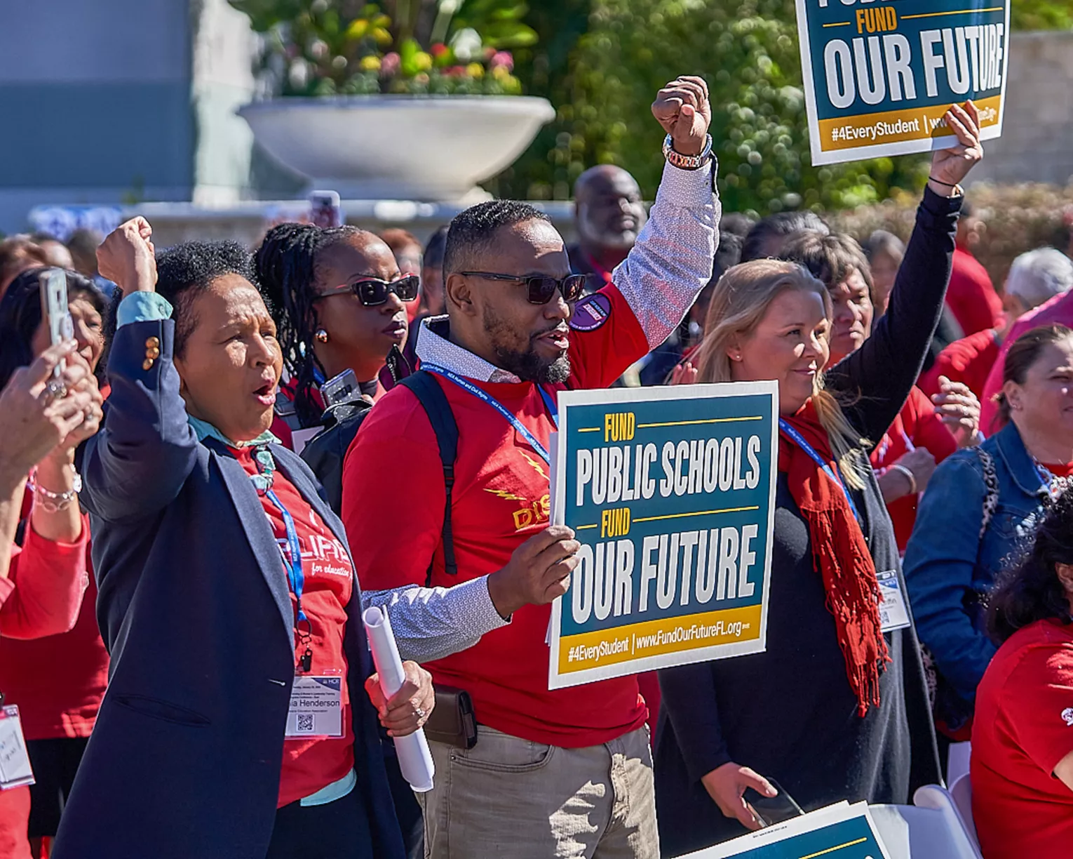 Members at a fund public schools rally