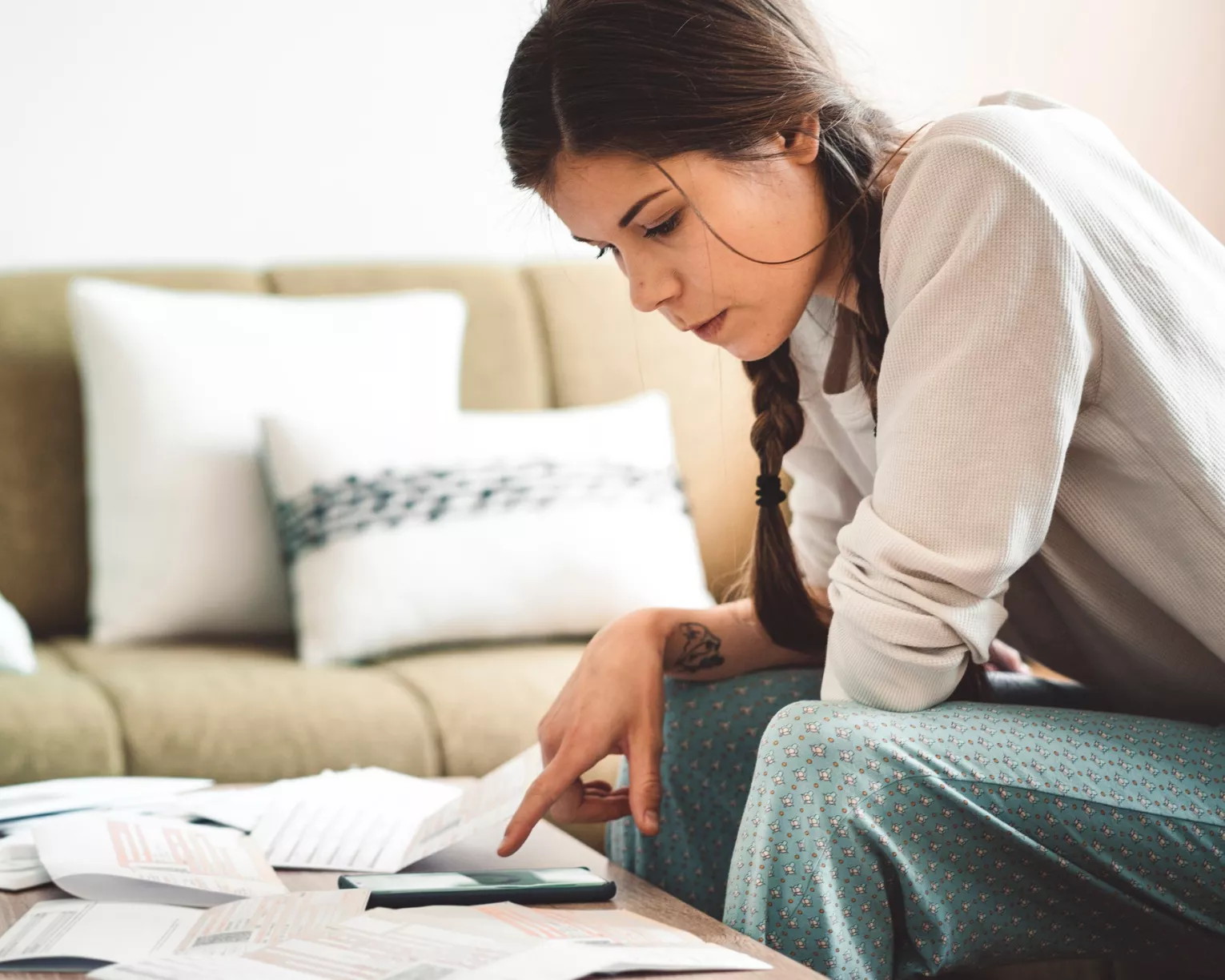 Young woman figuring out finances