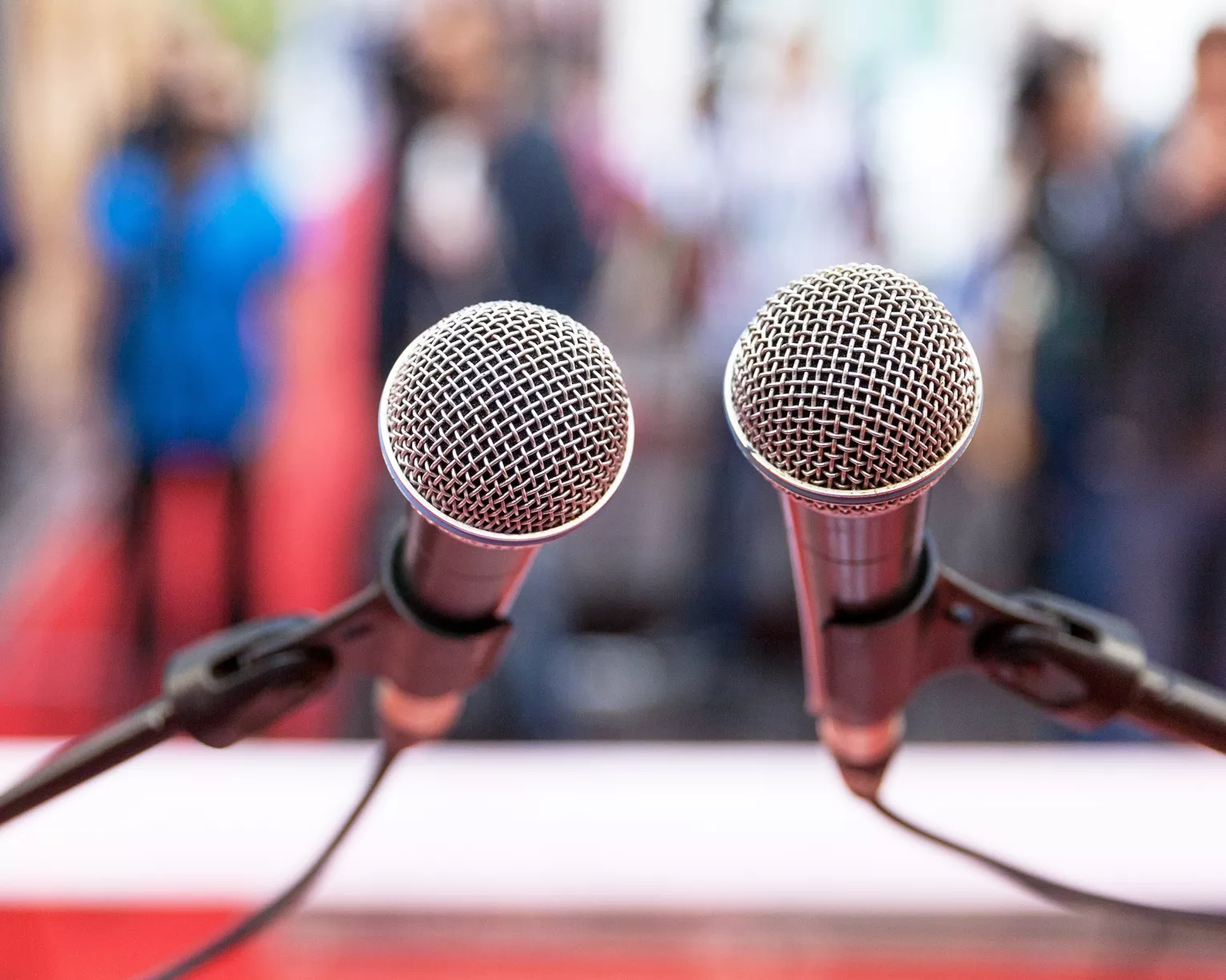 First-person view of microphones on a podium