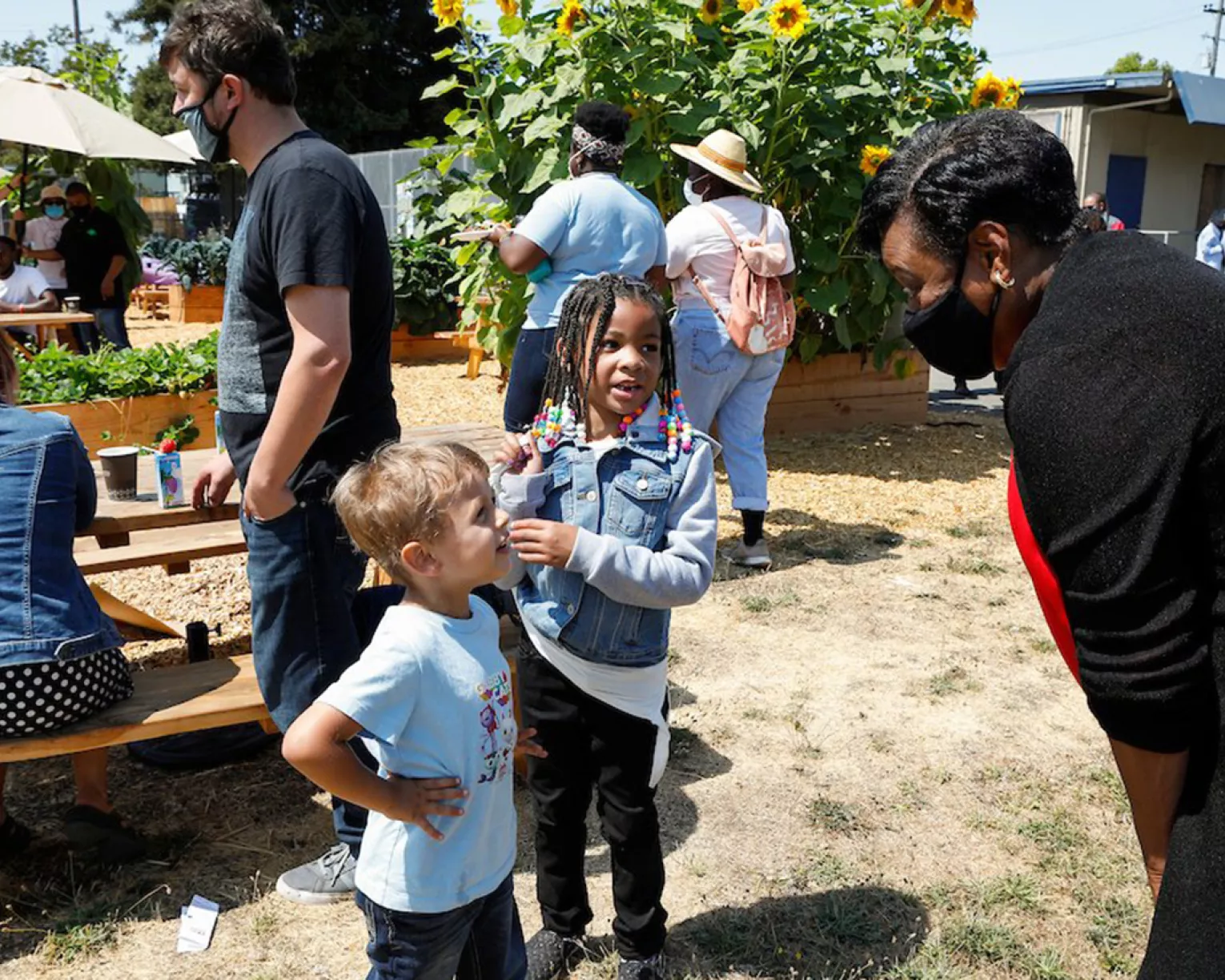Becky Pringle talks to young children at school barbecue in California