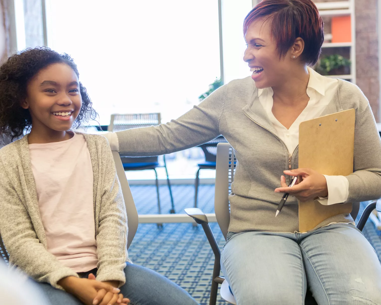 School counselor supports a young student during a group session