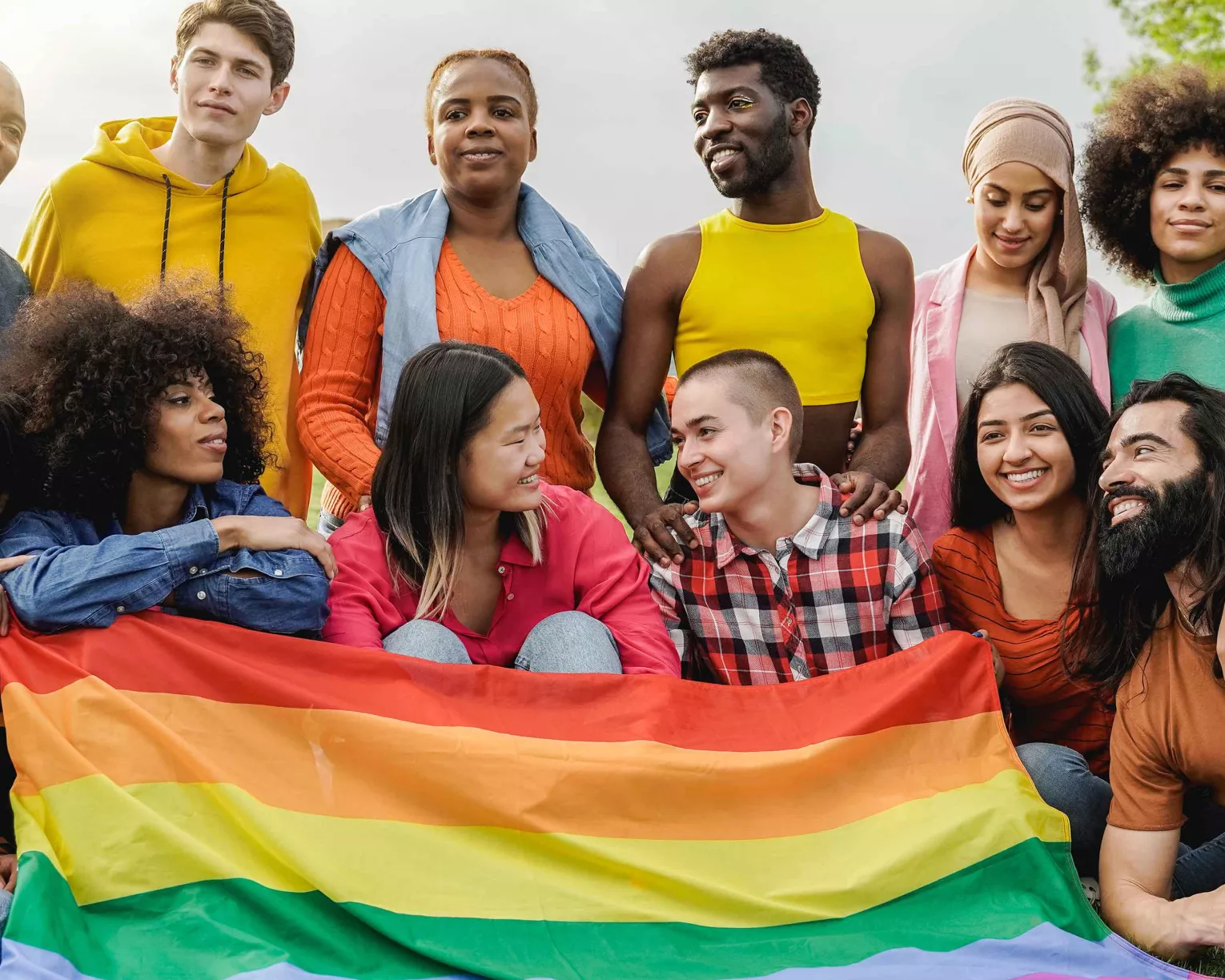 Group of students with rainbow flag