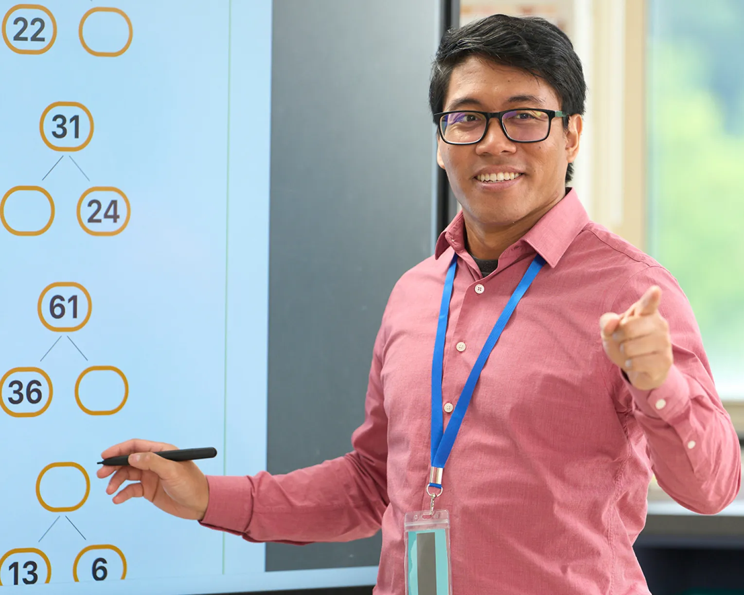 Male math teacher with glasses teaching a lesson