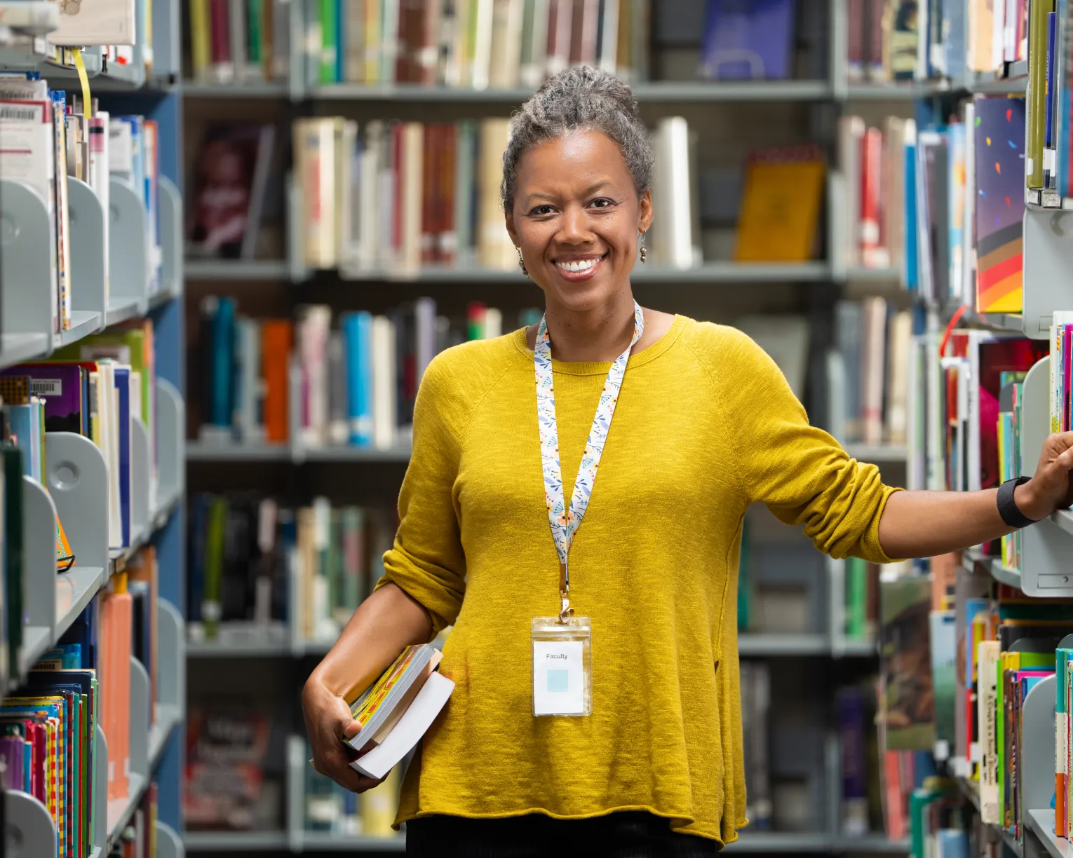 Librarian with stack of books