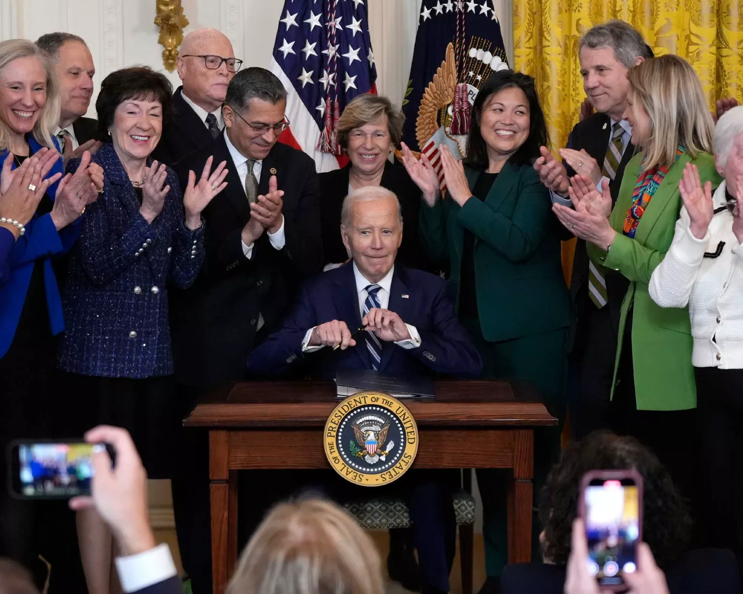 President Joe Biden signs the Social Security Fairness Act during a ceremony in the East Room of the White House, Sunday, Jan. 5, 2025, in Washington.