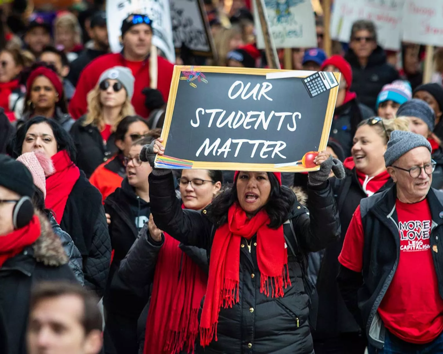 chicago teachers strike, teacher holding sign that says "Our students matter"