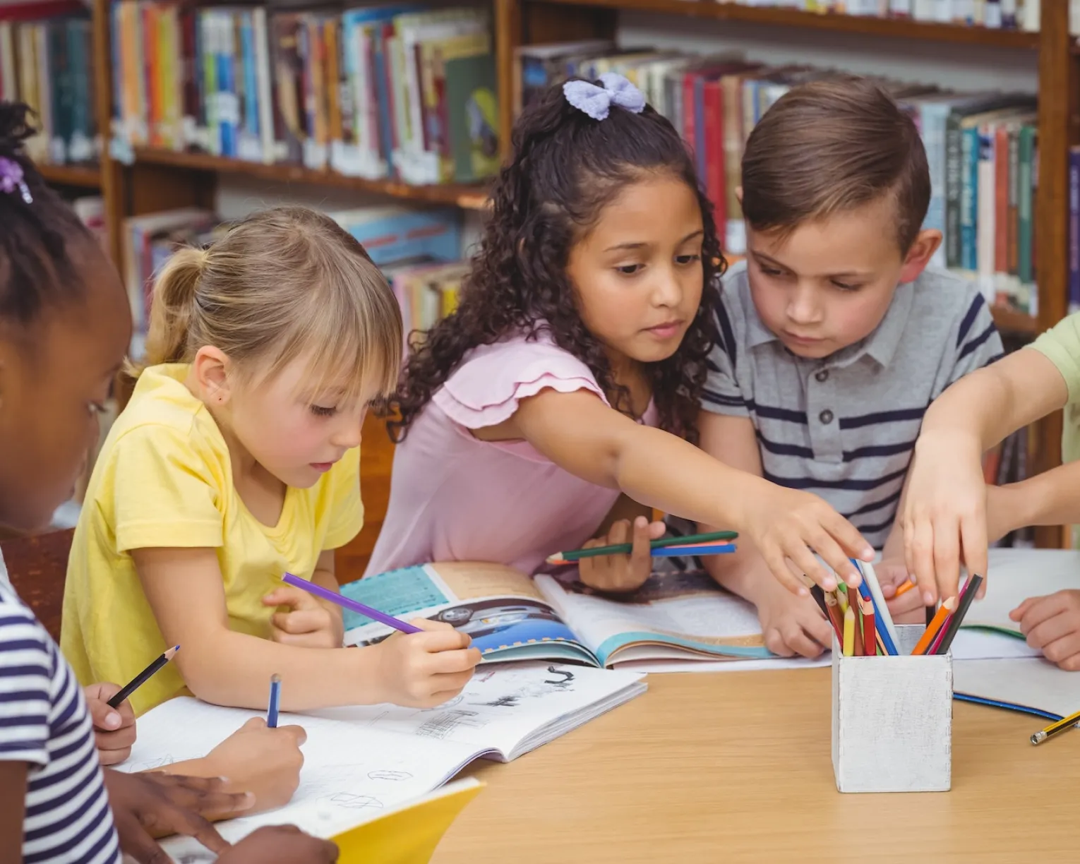 Young students around a table