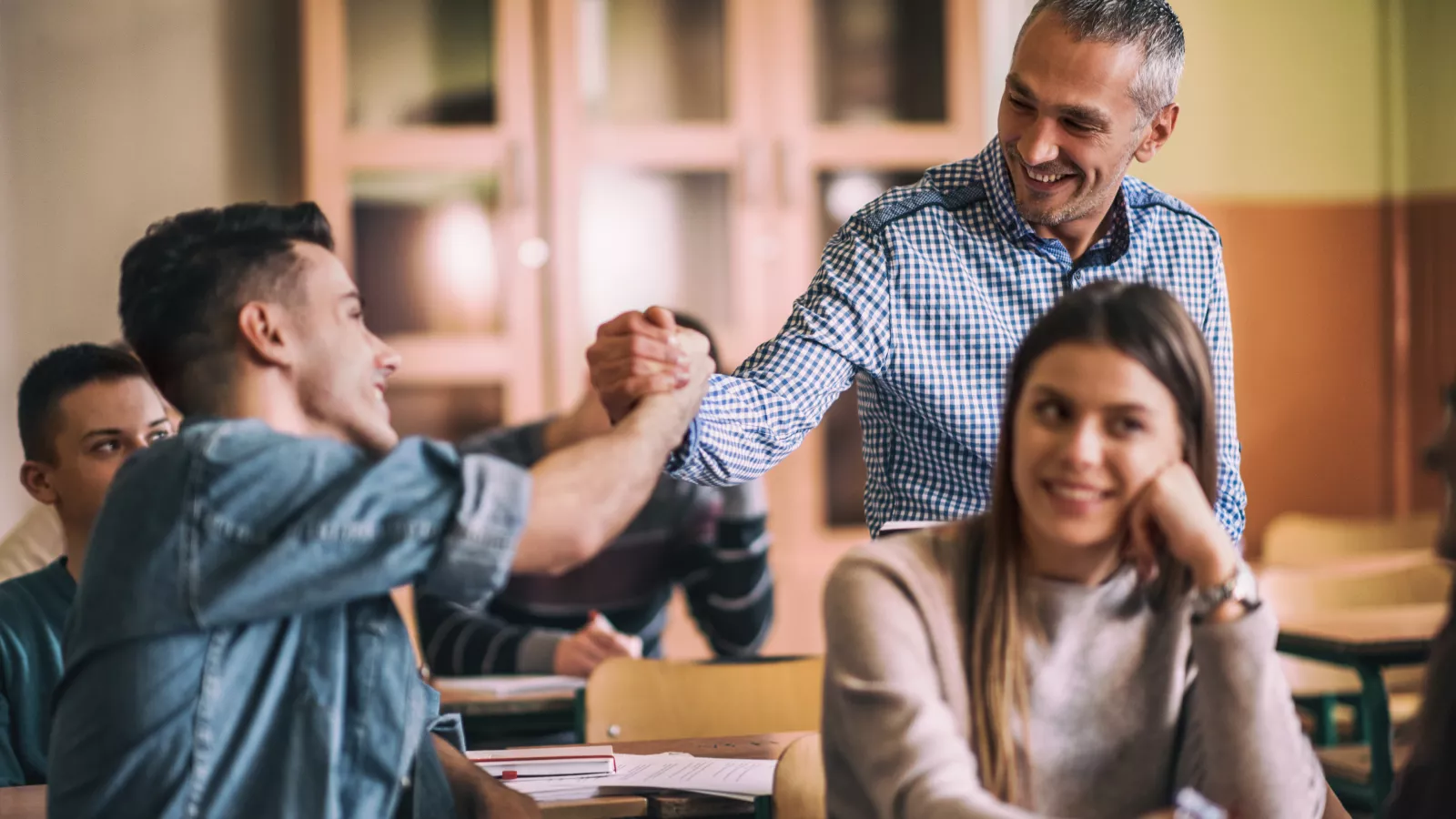 Educator connecting with students