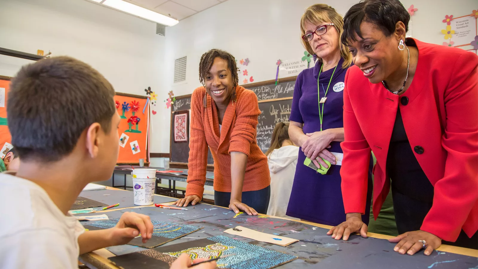 NEA members and leadership in a school classroom