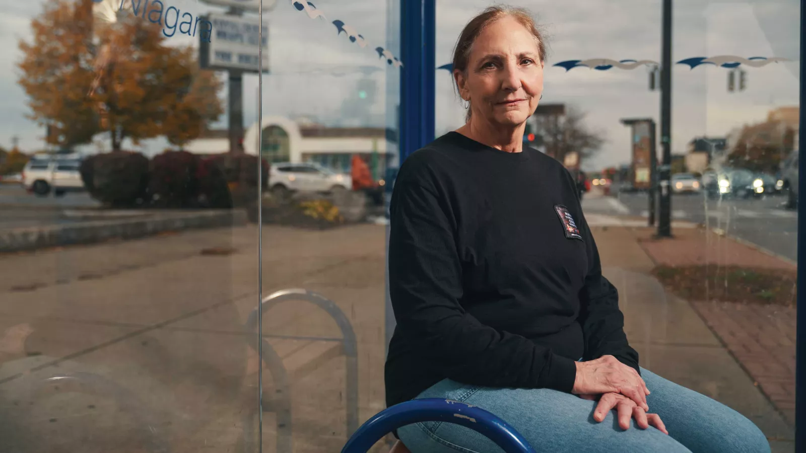NEA-Retired member Chris Salamone, at a bus stop in Buffalo, N.Y.