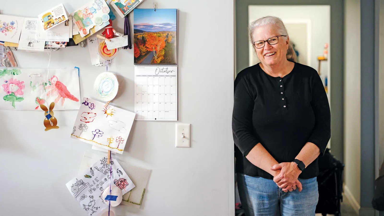 Maine retiree Jane Conroy rotates former students’ drawings on her seasonal “Wall of Fame”