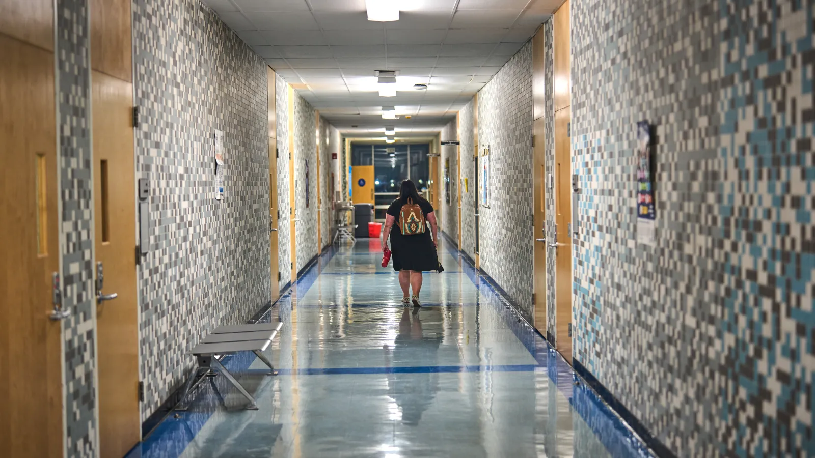 Crystal Huckabee walking down hall